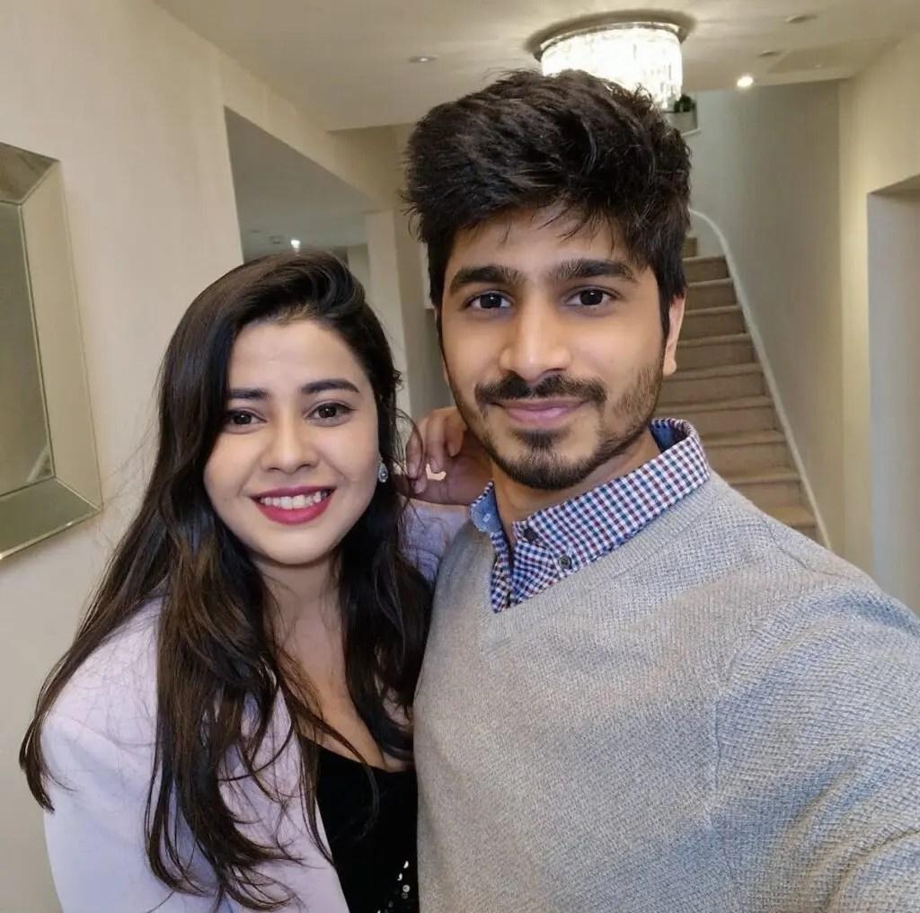 Chaitra and Parth indoors smiling