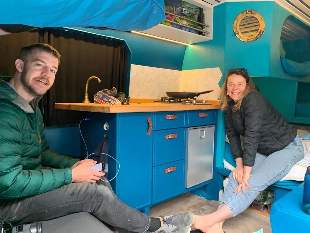 Matt and Nicola inside a camper van.
